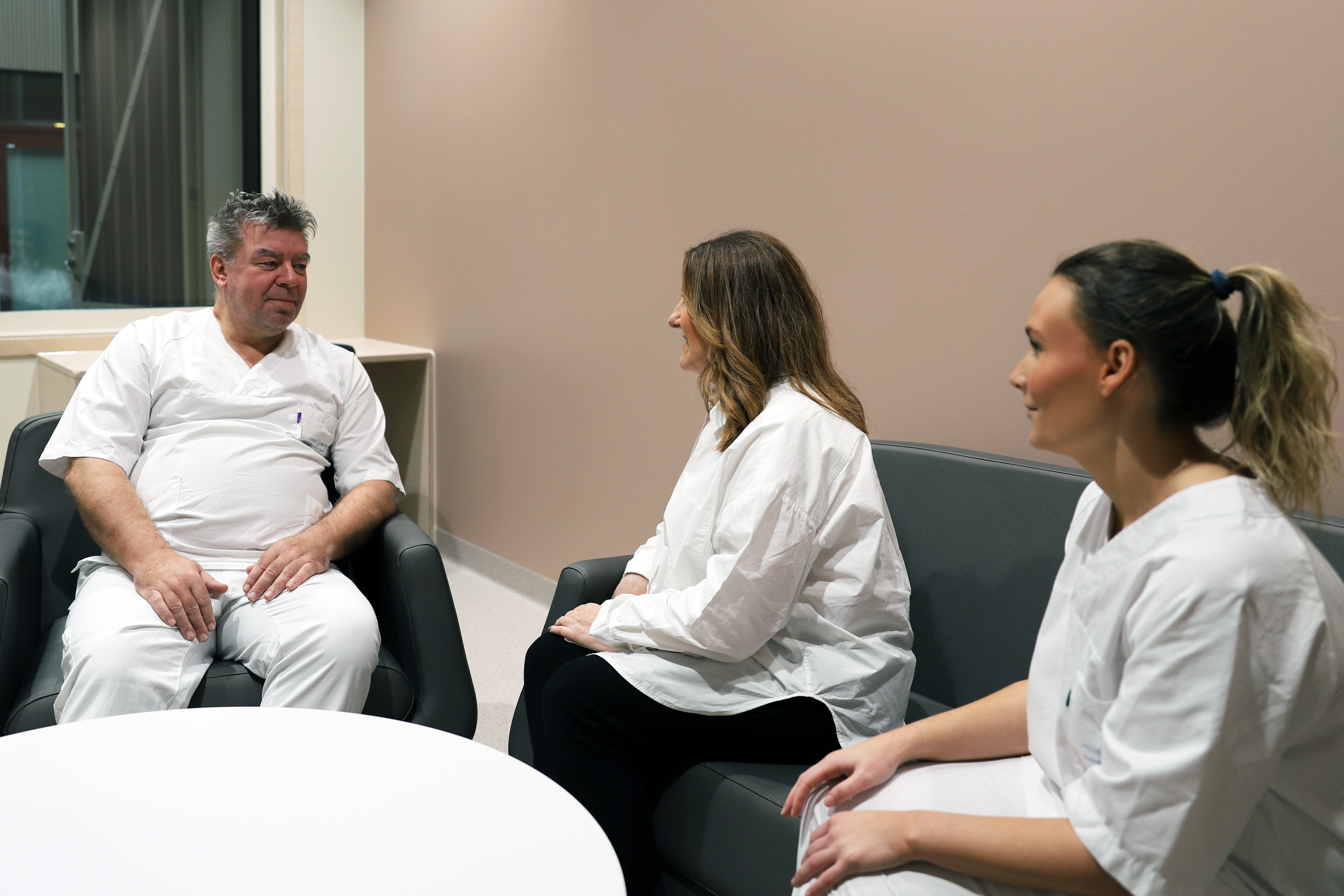 A few people sitting in chairs