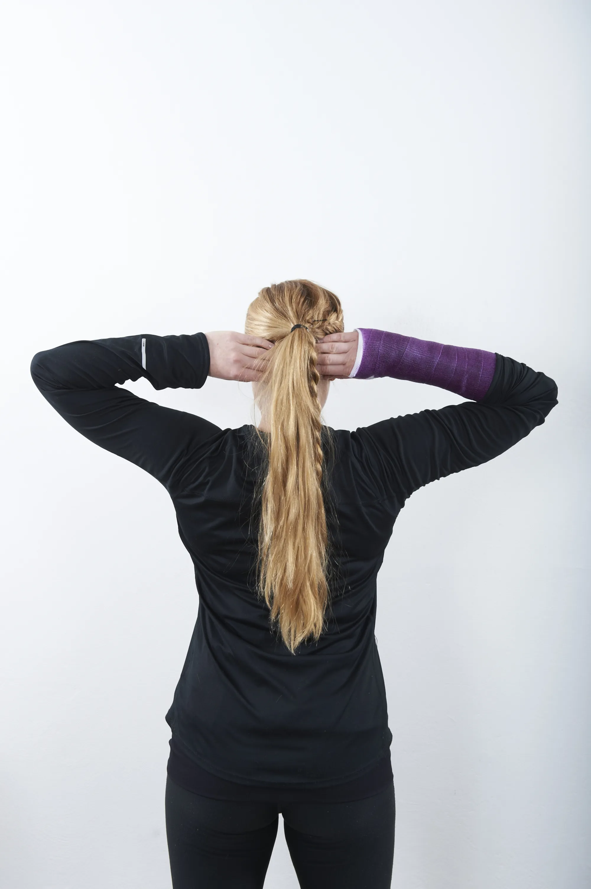 A person with the hands in the hair