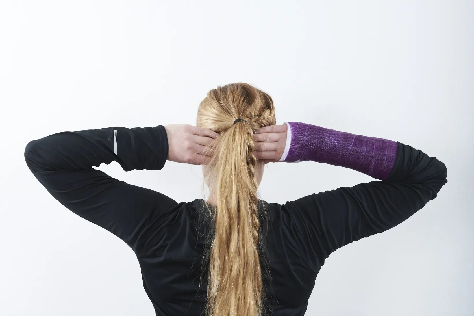 A person with the hands in the hair