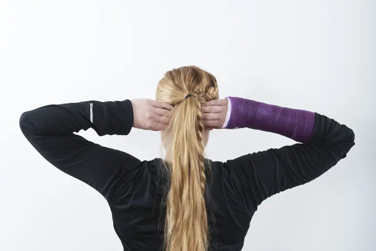 A person with the hands in the hair