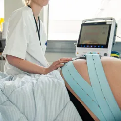 A doctor checking a patient's pulse